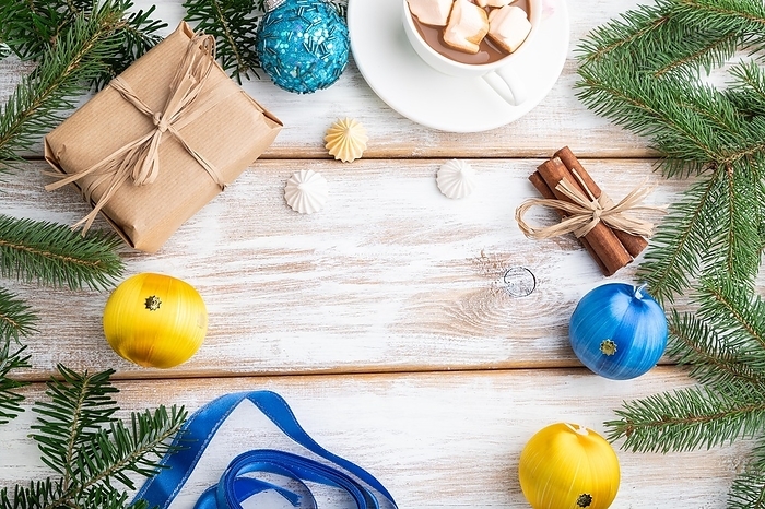 Christmas or New Year frame composition. Decorations, box, balls, cinnamon, ribbons, fir and spruce branches, cup of coffee, on a white wooden background. Top view, copy space, flat lay, by ULADZIMIR ZGURSKI