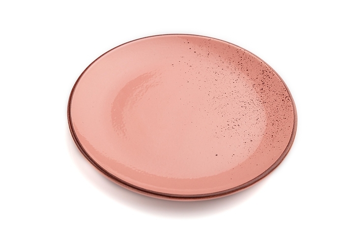 Empty pink dotted ceramic plate isolated on white background. Side view, close up, by ULADZIMIR ZGURSKI