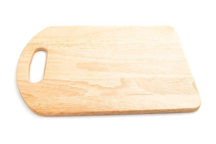 Wooden cutting board isolated on white background. Side view, close up, by ULADZIMIR ZGURSKI