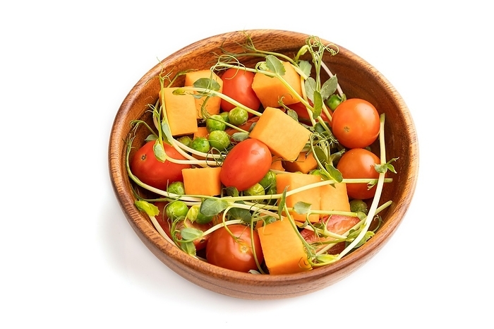 Vegetarian vegetable salad of tomatoes, pumpkin, microgreen pea sprouts isolated on white background. Side view, close up, by ULADZIMIR ZGURSKI
