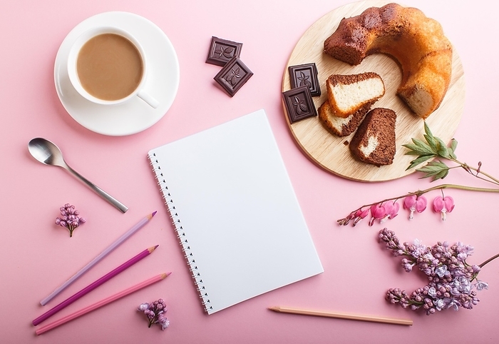Purple lilac and bleeding heart flowers and a cup of coffee with notebook, cake and colored pencils on pastel pink background. Morninig, spring, fashion composition. Flat lay, top view, by ULADZIMIR ZGURSKI