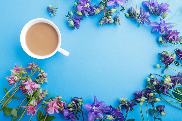 Pink and purple columbine flowers and a cup of coffee on pastel blue background. Morninig, spring, fashion composition. Flat lay, top view, copy space, by ULADZIMIR ZGURSKI