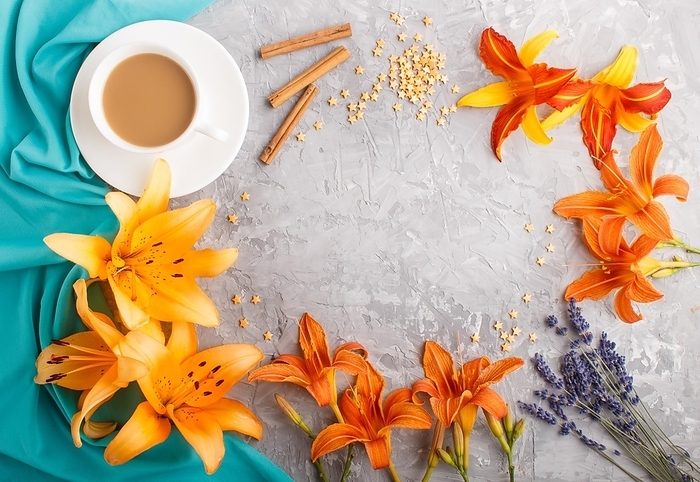 Orange day-lily and lavender flowers and a cup of coffee on a gray concrete background, with blue textile. Morninig, spring, fashion composition. Flat lay, top view, copy space, by ULADZIMIR ZGURSKI