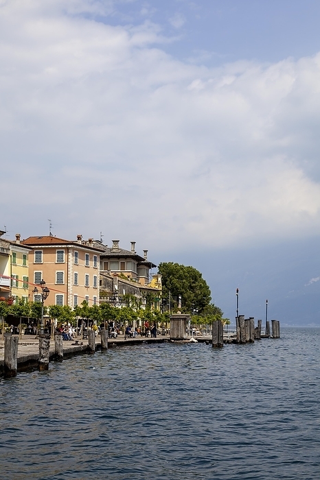 Italy Waterfront promenade with restaurants in Gargnano, Lake Garda, Province of Brescia, Lombardy, Italy, Europe, by AnnaReinert