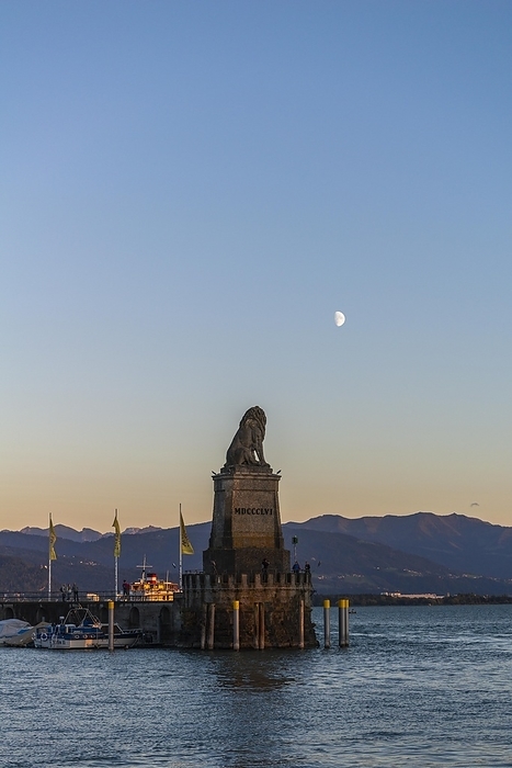 Lindau on Lake Constance, entrance to the harbour, Bavarian lion, pier, motorboats, view of the Alps, half moon, evening light, Bavaria, Germany, Europe, by Wolfgang Diederich