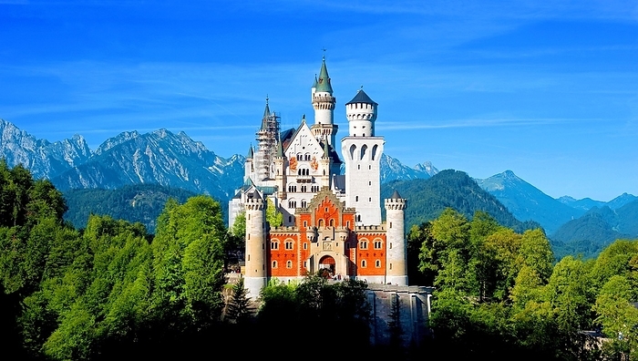 Germany Neuschwanstein Castle in the sun and green forest and blue sky, near F ssen in the Allg u, Bavaria, Germany, Europe, by Dirk v. Mallinckrodt