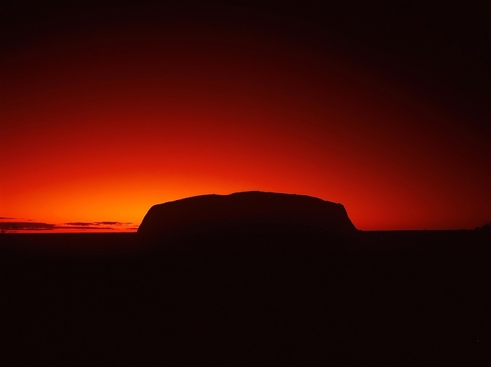 Australia Silhouette outline of Ayers Rock or Uluru in red sunrise or sunset, dusk or dawn, red sky, Northern Territory, Australia, Oceania, by Dirk v. Mallinckrodt