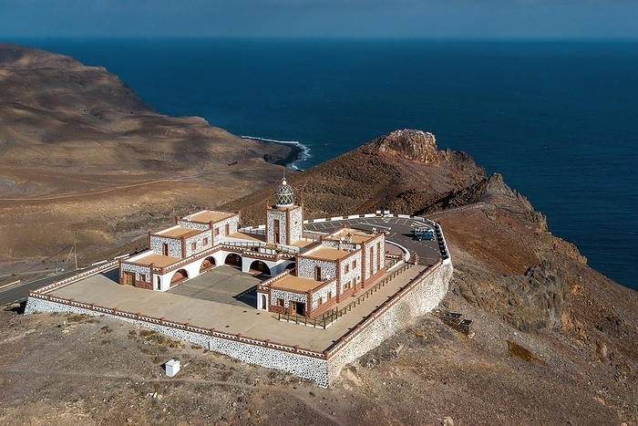 Spain Bird s eye view of aerial view of building complex of lighthouse Faro de la Entallada from 50s year 1953 1954 with large glass dome on 183 metres high cliff, behind it steep coast and Mirador de Entallada, Las Playitas, Tuineje, Las Palmas, Fuerteventura, Canary Islands, Spain, Europe, by Frank Schneider