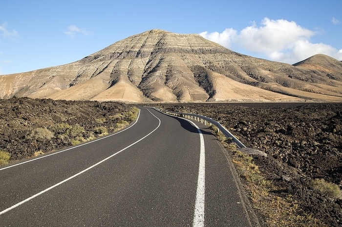 Spain Road leading towards Montana de Medio, mountain, Los Ajaches mountain range, Lanzarote, Canary Islands, Spain, Europe, by Ian Murray