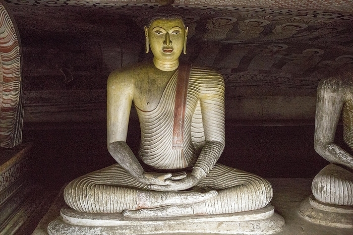 Sri Lanka Buddha figure inside Dambulla cave Buddhist temple complex, Sri Lanka, Asia, by Ian Murray
