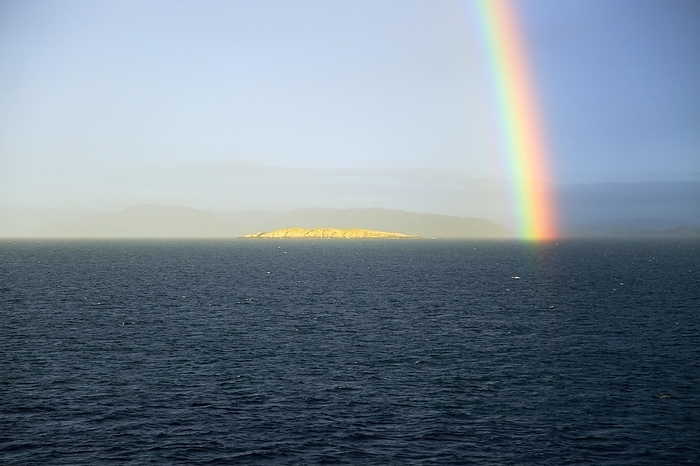 Norway Seascape view of spectrum colours in rainbow over sea and island, Norway, Europe, by Ian Murray