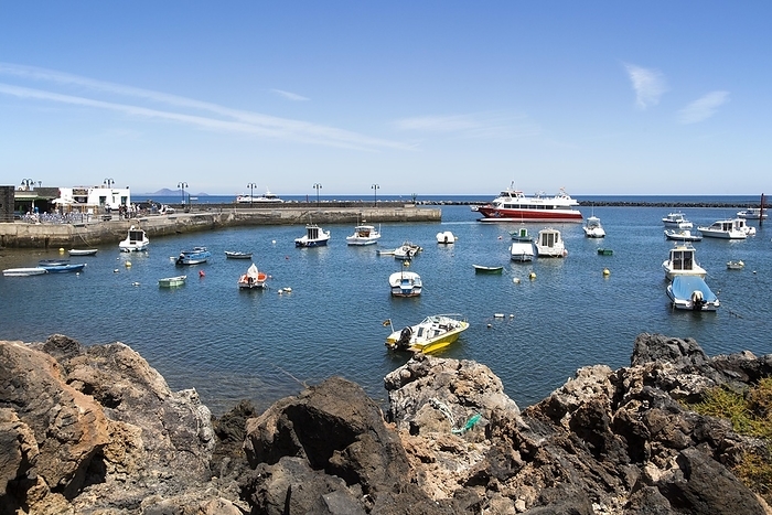 Spain Harbour and ferry boat in the fishing village of Orzola, Lanzarote, Canary Islands, Spain, Europe, by Ian Murray