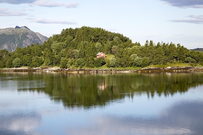 Norway Isolated coastal house on small wooded island near Ornes, Nordland, Norway, Europe, by Ian Murray