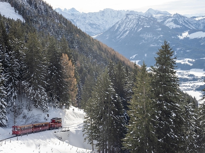 Austria Winter landscape, Schafberg cog railway decorated for Christmas travelling up to the Schafbergalm, St.Wolfgang, Salzkammergut, Upper Austria, Austria, Europe, by Karl Heinz Schein