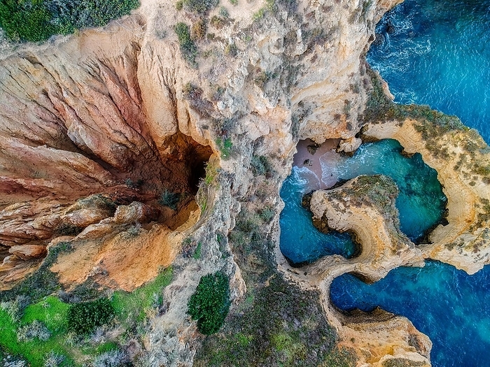 Portugal Aerial view, drone shot showing the dramatic coastline with cliffs and sea, Algarve, Lagos, Portugla, Europe district Faro region in Portugal, by Tobias Huet