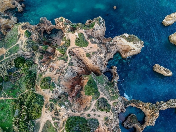Portugal Aerial view of a picturesque coastline with cliff formations by the sea, Algarve, Lagos, Portugla, Europe district Faro region in Portugal, by Tobias Huet