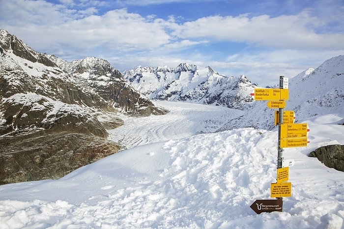 Switzerland Signpost and view over the mountains in winter surrounding the Swiss Aletsch Glacier, largest glacier in the Alps, Switzerland, Europe, by alimdi   Arterra