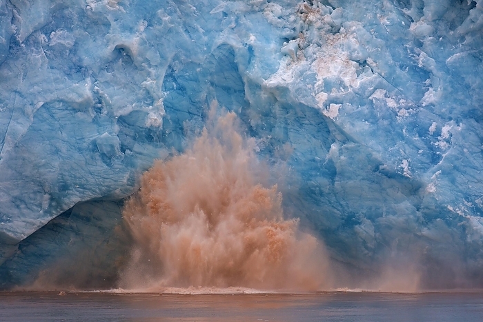 Norway Huge ice chunk breaking from the edge of the Kongsbreen glacier calving into Kongsfjorden, Svalbard, Spitsbergen, Norway, Europe, by alimdi   Arterra