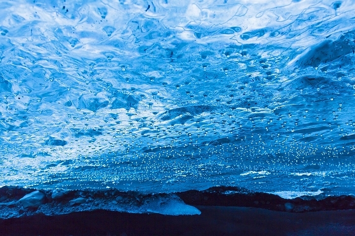 Iceland Droplets, water dripping from ceiling inside natural ice cave in Brei amerkurj kull, Breidamerkurjokull Glacier in Vatnaj kull National Park, Iceland, Europe, by alimdi   Arterra