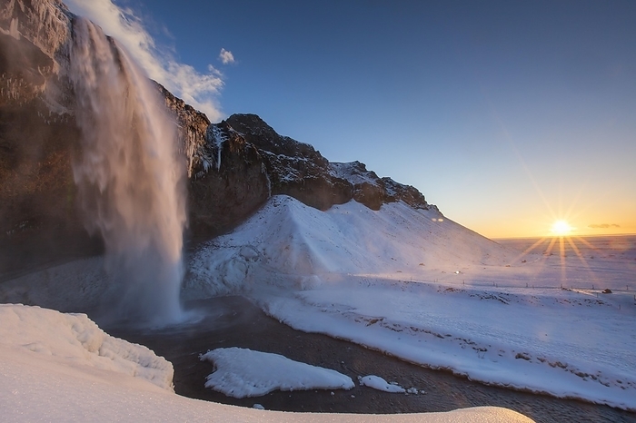 Iceland Seljalandsfoss, 66 m high waterfall situated on the river Seljalands  in winter, Rang r ing eystra, Iceland, Europe, by alimdi   Arterra