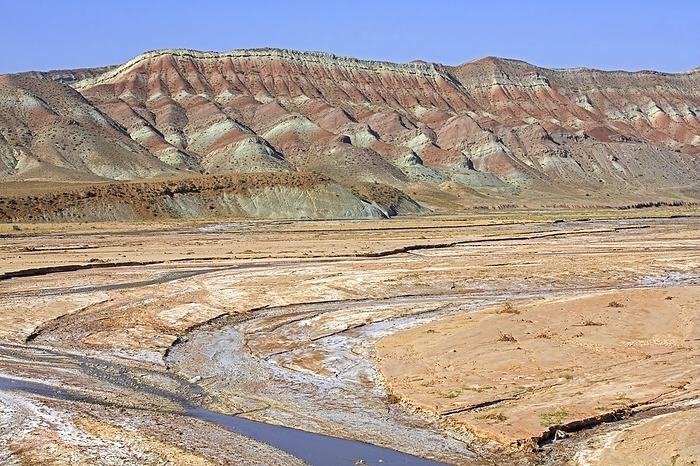 Azerbaijan Semi arid Azerbaijan shrub desert landscape showing mountain with sediment layers and riverbed, East Azerbaijan Province, Iran, Asia, by alimdi   Arterra   Marica van der Meer