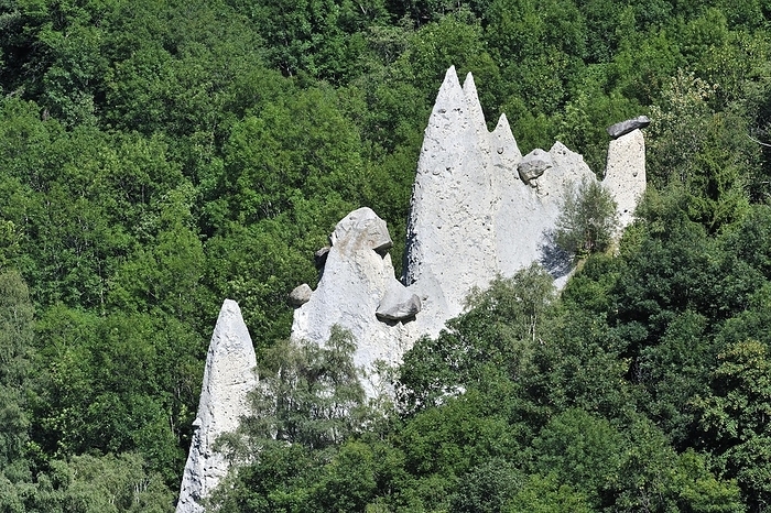 Switzerland The Pyramids of Euseigne in the canton of Valais, Switzerland. Rocks of harder stone stacked on top protect the columns from rapid erosion, creating these pyramidal rock formations, by alimdi   Arterra   Philippe Cl ment