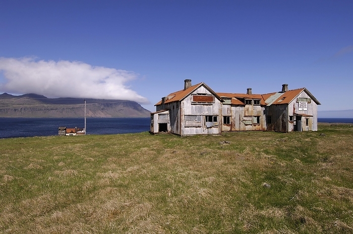 Iceland Old abandoned hospital building at the mouth of Faskrudfjordur in the East Fjords region of eastern Iceland, by Klaus Steinkamp
