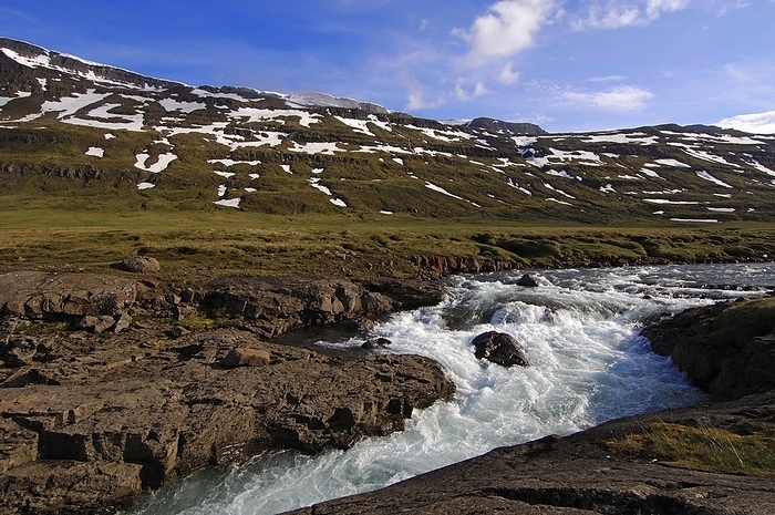 Iceland The Fjardara River swollen with spring melt water, near Seydisfjordur, east Iceland, by Klaus Steinkamp