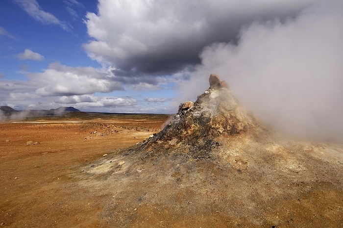 Iceland Close up of steaming vent or fumarole in a geothermal landscape with a view of distant hills at Hverarond near Myvatn, north Iceland, by Klaus Steinkamp