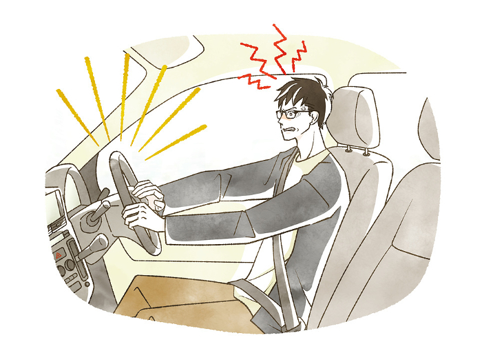 Frustrated man behind the wheel of a car