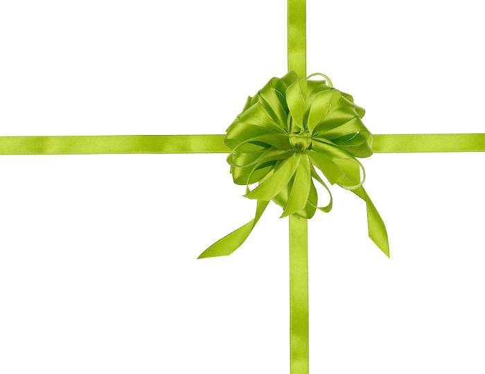 Green ribbon with a cross and a big bow on an isolated background, packaging for a gift. Top view Green ribbon with a cross and a big bow on an isolated background, packaging for a gift. Top view