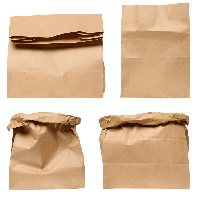 A large empty brown kraft paper bag for packaging products in stores on an isolated background, set A large empty brown kraft paper bag for packaging products in stores on an isolated background, set