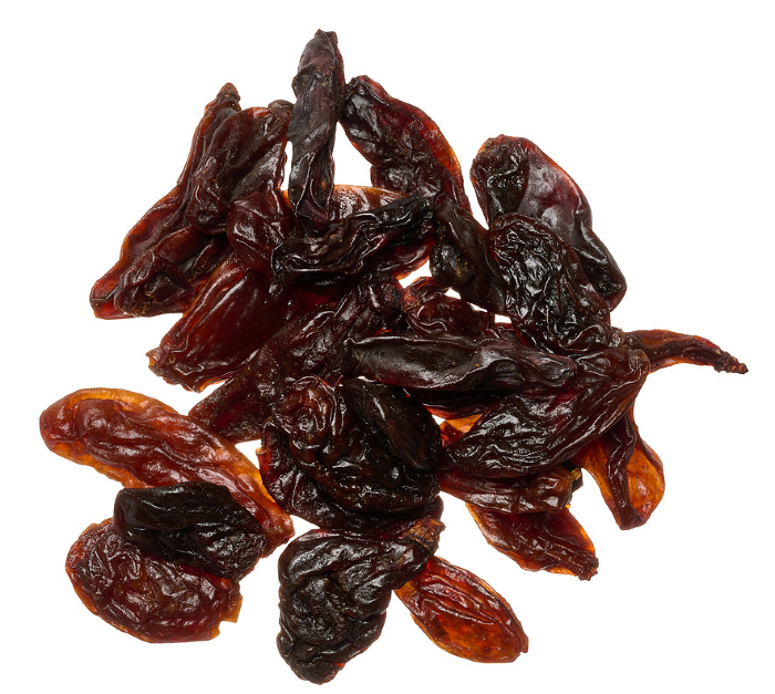 Pile of raisins on isolated background, top view Pile of raisins on isolated background, top view