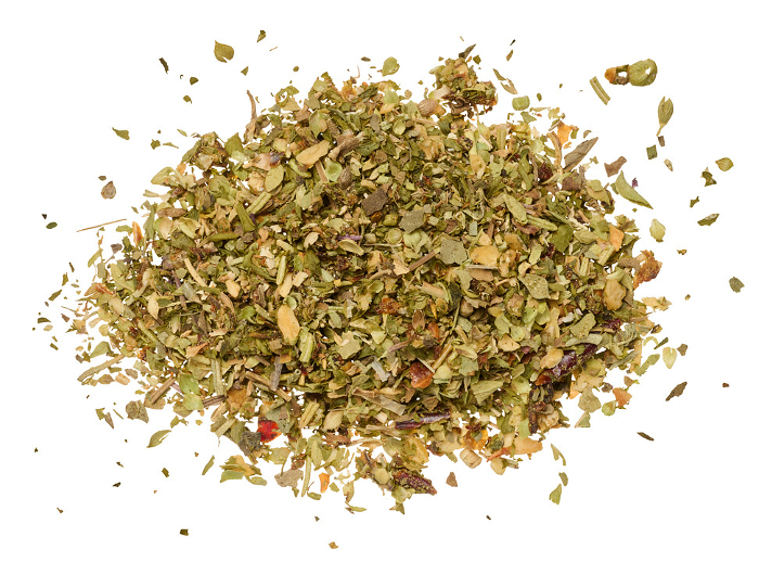 Chopped dry leaves of basil, parsley, dill and sun dried tomatoes on an isolated background. View from above Chopped dry leaves of basil, parsley, dill and sun dried tomatoes on an isolated background. View from above
