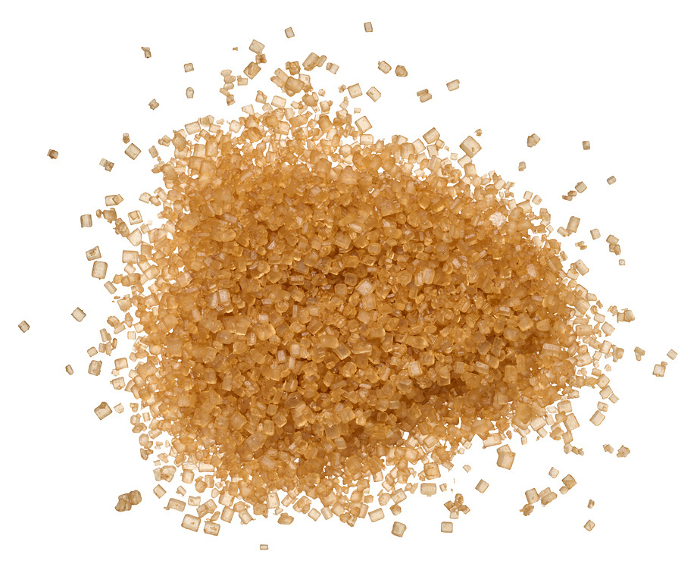 Brown cane sugar granules on isolated background, top view Brown cane sugar granules on isolated background, top view