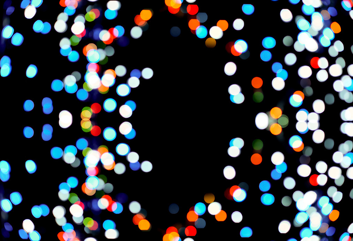 Multi colored bokeh on a black background, blurry lights of light bulbs Multi colored bokeh on a black background, blurry lights of light bulbs