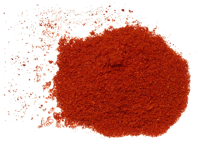 Ground smoked paprika on isolated background, top view Ground smoked paprika on isolated background, top view