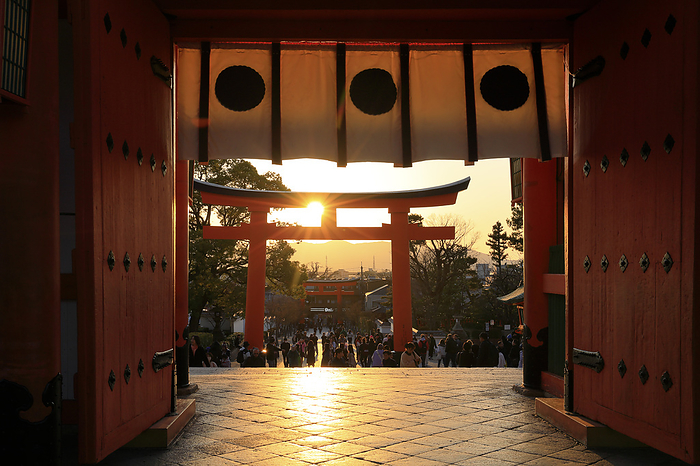 Torii gate and sunset over the gate of Fushimi Inari-taisha shrine, Kyoto