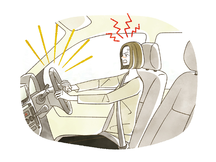 Frustrated woman driving a car.