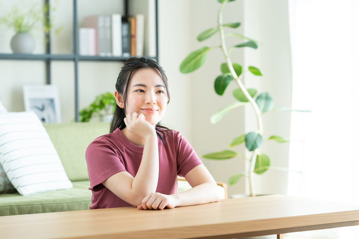 Young Japanese woman relaxing in the living room (People)