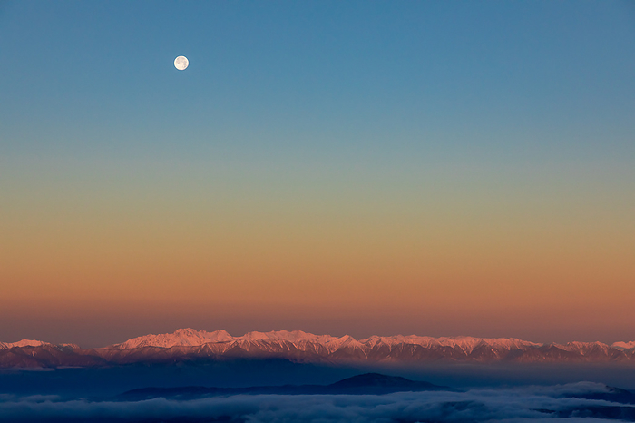 Morgenrot and the moon in the Northern Alps Nagano, Japan Yatsugatake, photographed from Mt.
