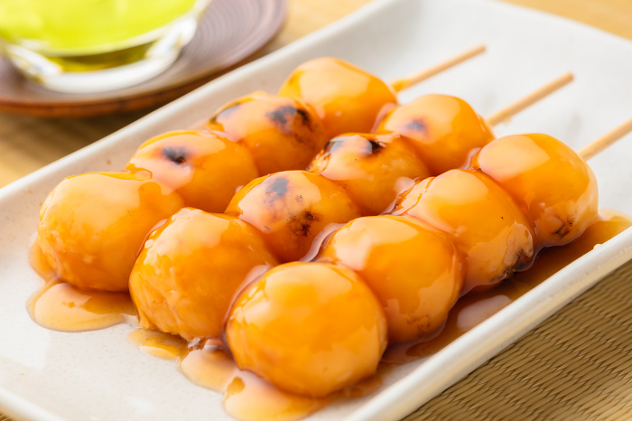 skewered rice dumplings in a sweet soy glaze