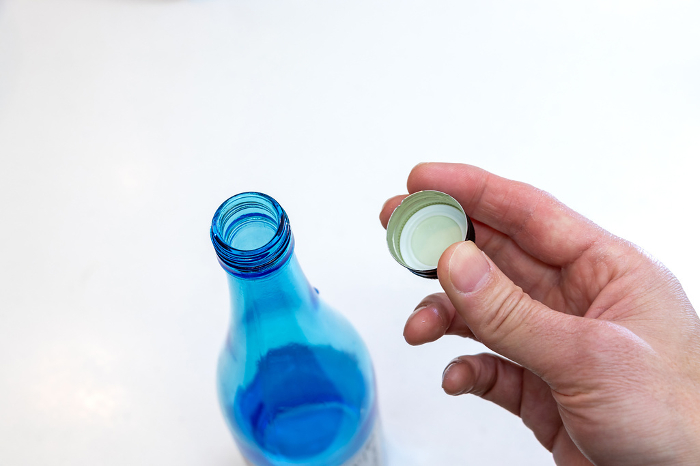 Mouth of glass bottle with cap removed
