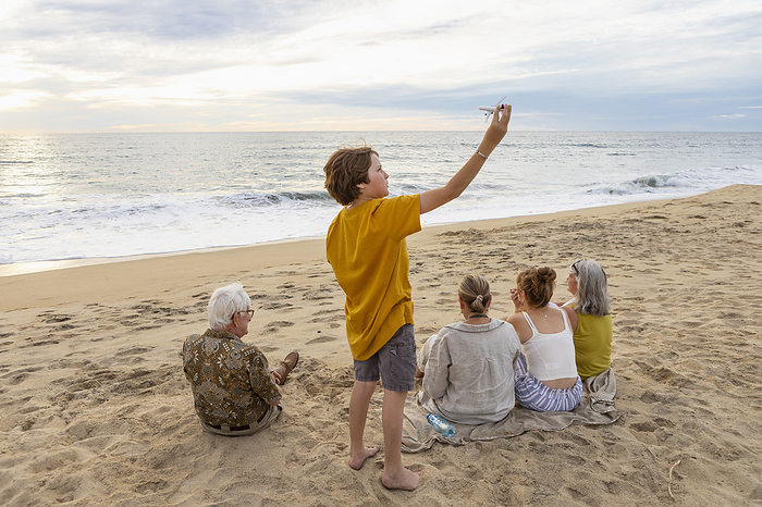 extended family on beach at sunset, Mexican Baja Mexico, Baja, Pescadero, Three generation family on beach
