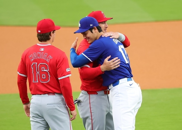 2024 MLB Open Game  Dodgers Angels Otani and Trout hug before the game  Photo by Yoshiki Shiratori .