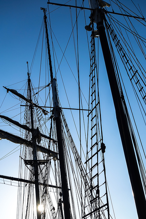Silhouettes of the masts and rigging of a sailing ship Silhouettes of the masts and rigging of a sailing ship, by Zoonar Katrin May