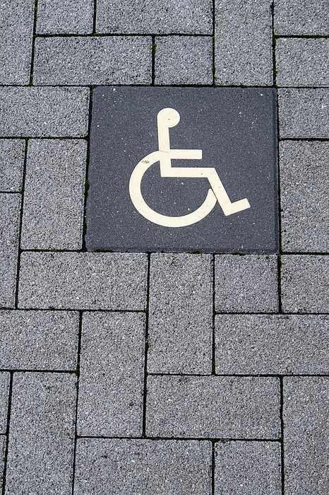 Pictogram disabled parking on paving stones Pictogram disabled parking on paving stones, by Zoonar AnnaReinert