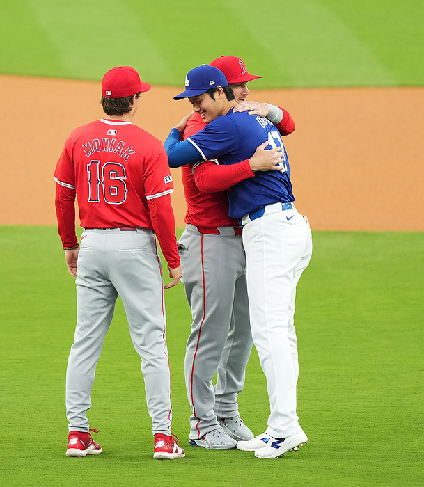 2024 MLB Open Game Dodgers vs. Angels Dodgers Shohei Ohtani hugs Angels  Mike Trout  right  before the game. On the left is Mackenzie Moniak March 24, 2024 date 20240324 place Dodger Stadium, Los Angeles, USA