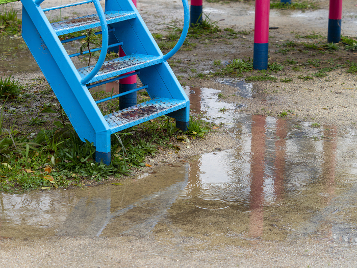 Park playground equipment and puddles