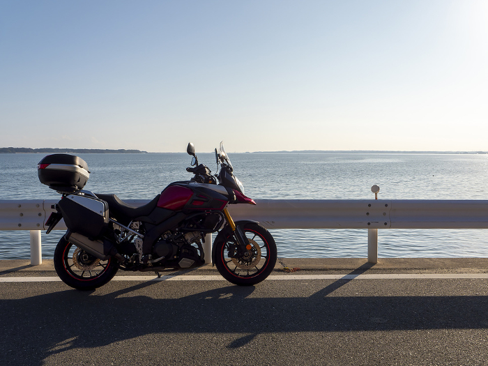 Scenery of Lake Hamana with blue sky and motorcycles